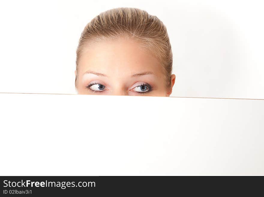 Caucasian blond woman peeping white board. Caucasian blond woman peeping white board