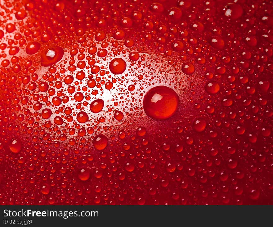 Water drops on abstract red surface. Water drops on abstract red surface.