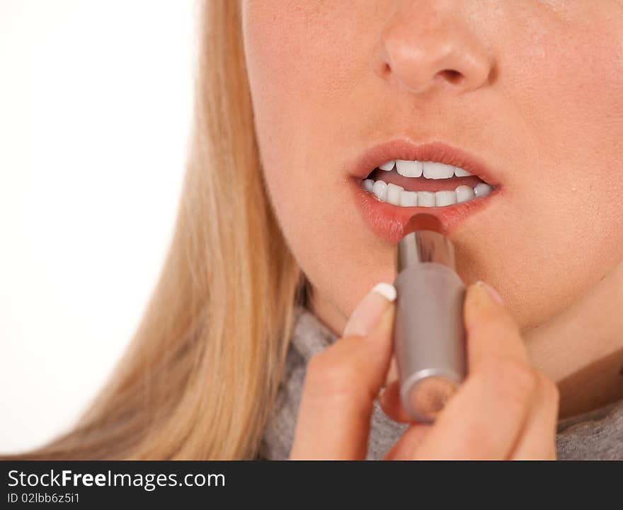 Woman with lipstick on white background closeup