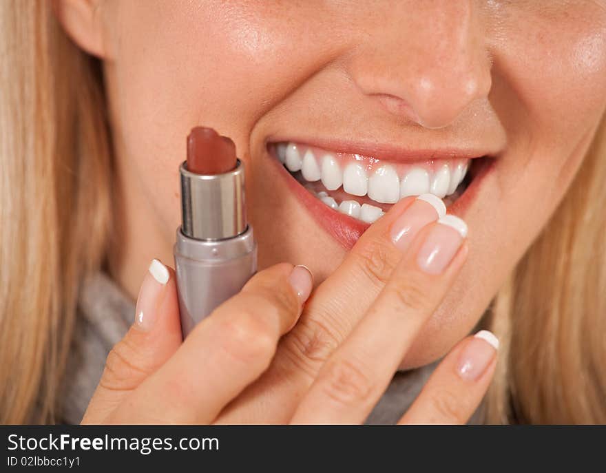 Woman with lipstick on white background closeup