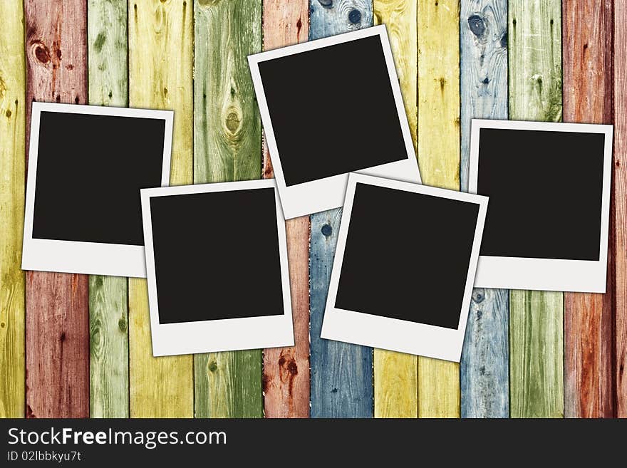 Blank photos on multicolored vintage wooden planks