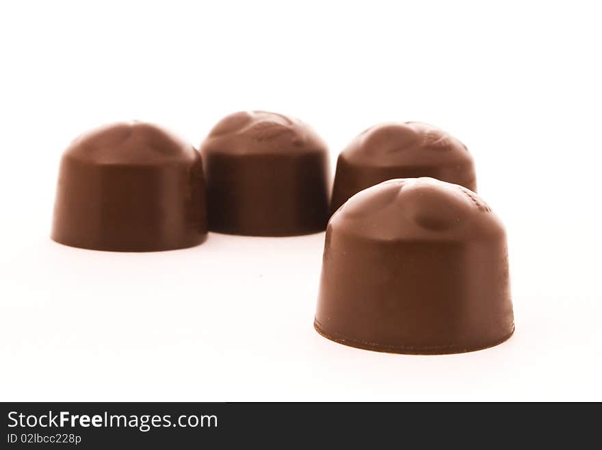 Chocolate candies isolated over white