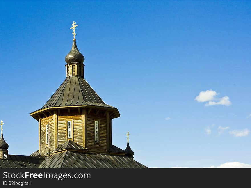 Wooden church over blue sky