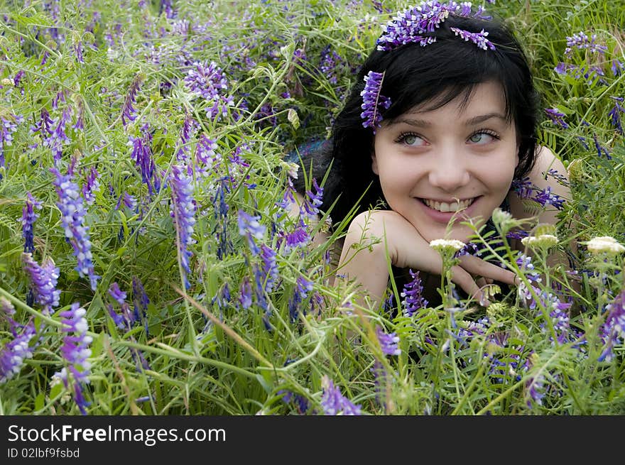 Beautiful Brunette Girl in Blue Flowers