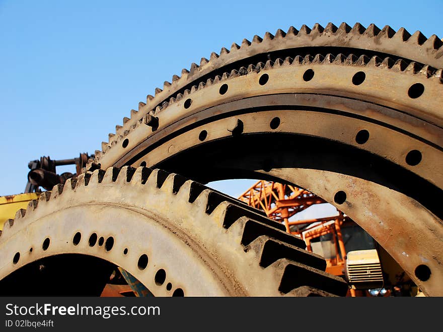 Old rusty heavy industrial machine gear cogwheel. Old rusty heavy industrial machine gear cogwheel