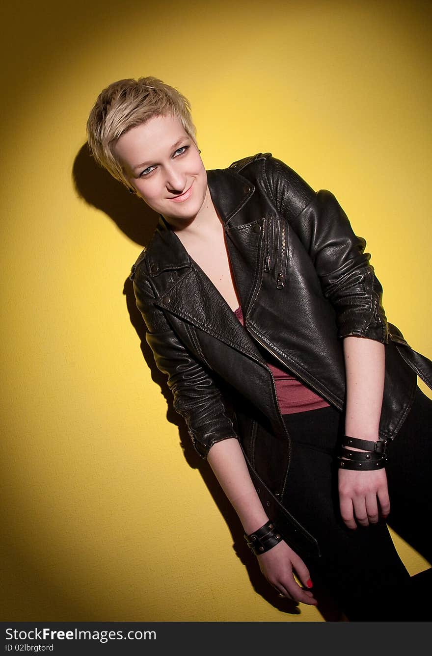 Smiling woman in leather jacket