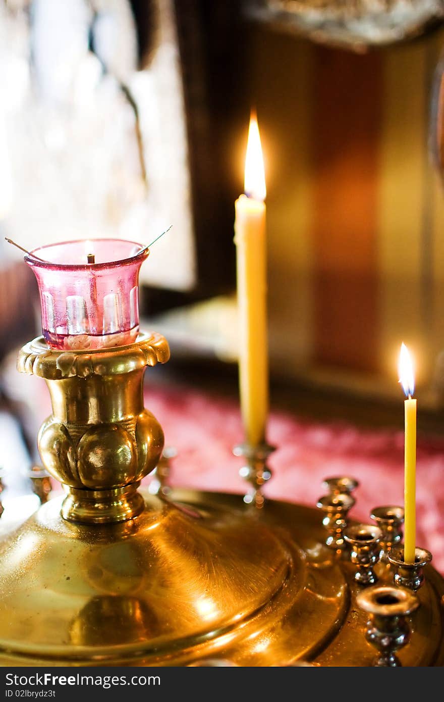 Two burning candles in an orthodox church. Two burning candles in an orthodox church