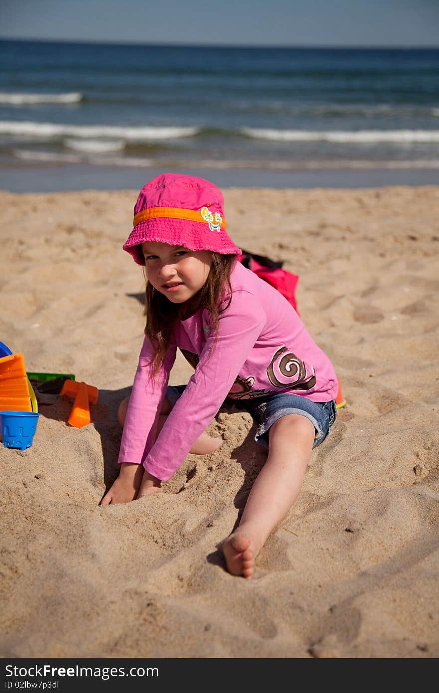 Girl playing at the beach. Girl playing at the beach