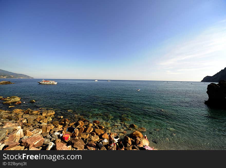 The sea near a beach. It is a sunny day. The sea near a beach. It is a sunny day.