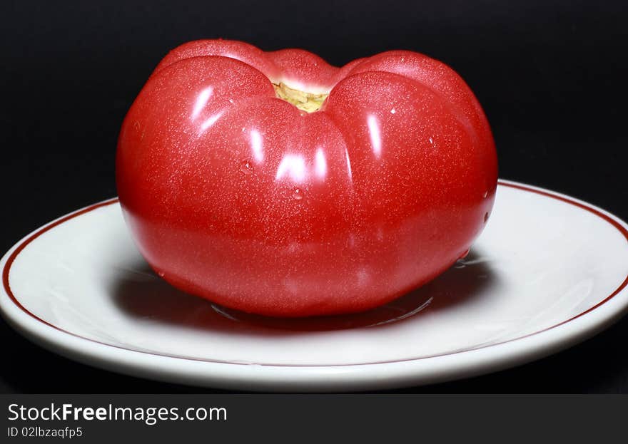 A tomato isolate on black background.