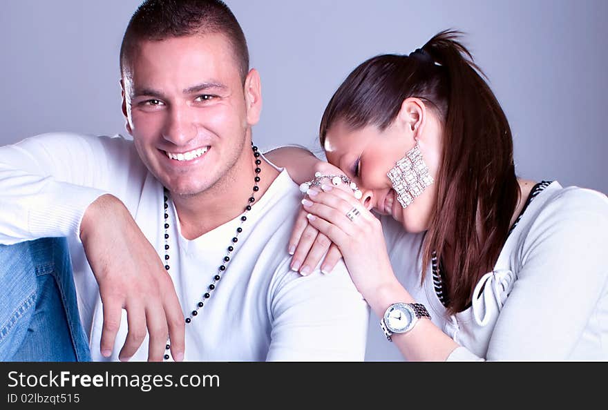 Young love couple smiling, studio shot