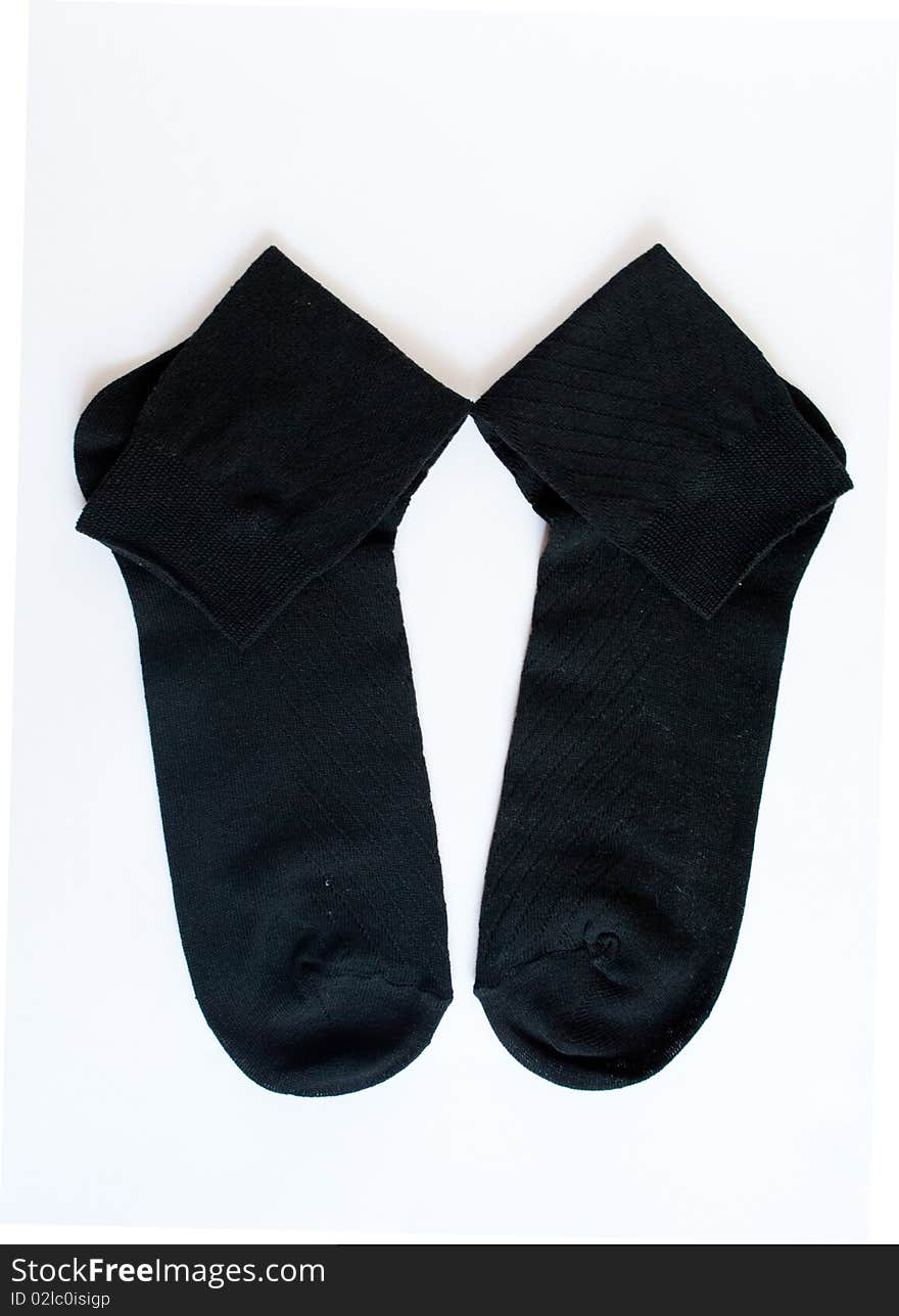 Black socks on the white background