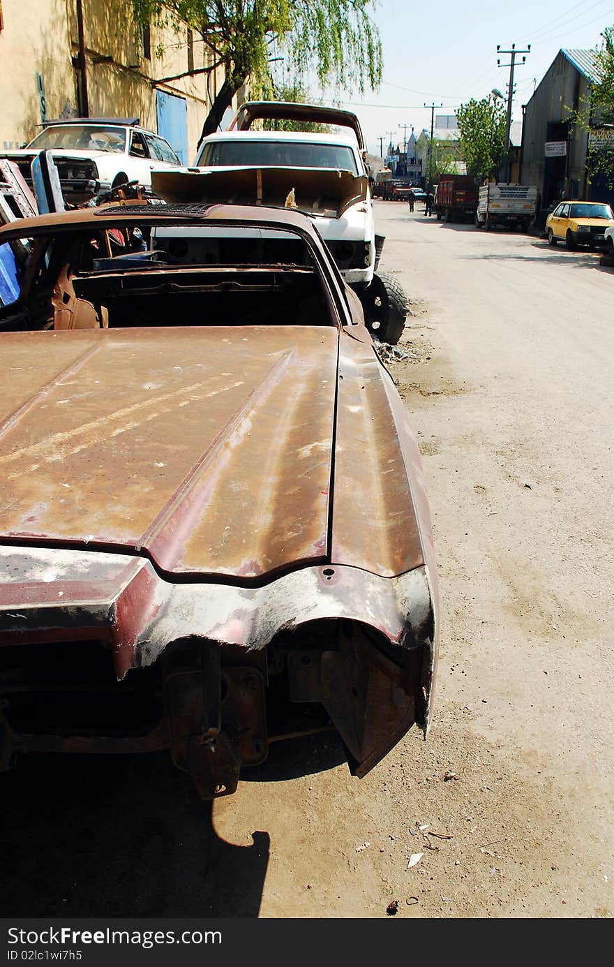 Vintage rusty old car abandoned on the side of the road. camaro. Vintage rusty old car abandoned on the side of the road. camaro