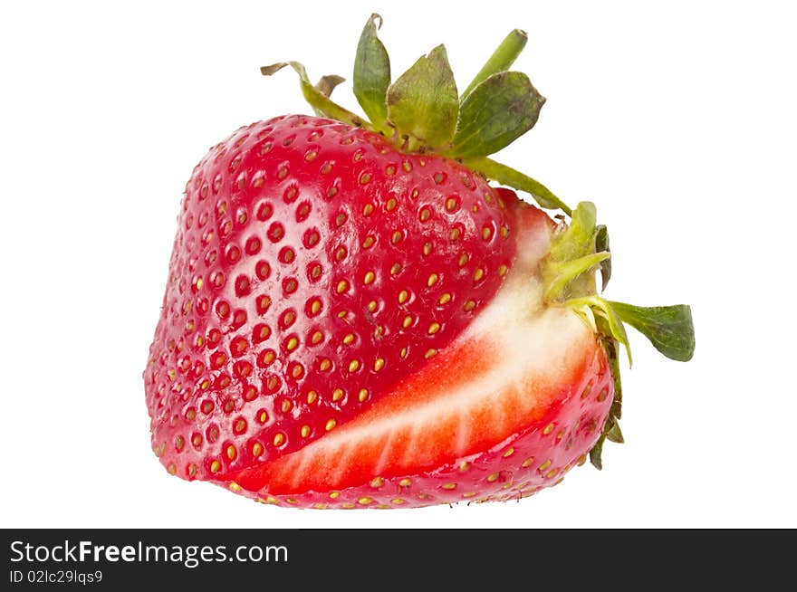 Sliced strawberry macro shot isolated over white background