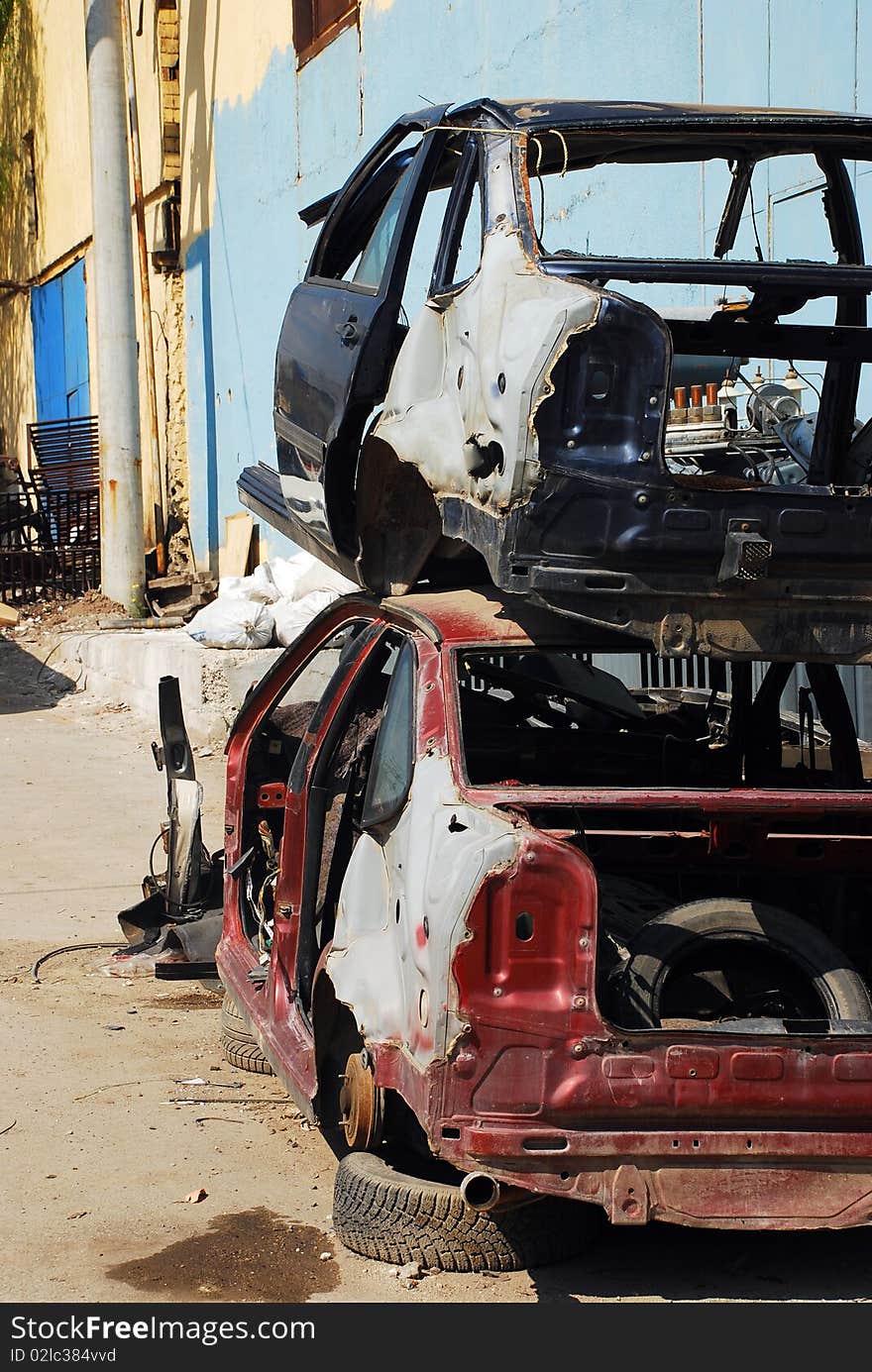 Wrecked cars and old vehicles in a scrap yard. Wrecked cars and old vehicles in a scrap yard