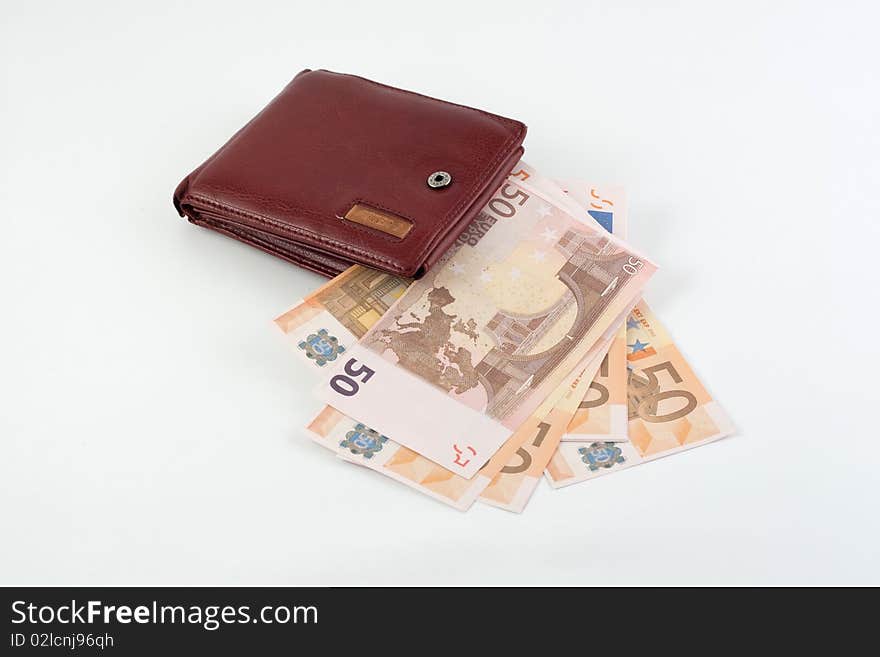 Banknotes falling from the wallet located on a white background. Banknotes falling from the wallet located on a white background