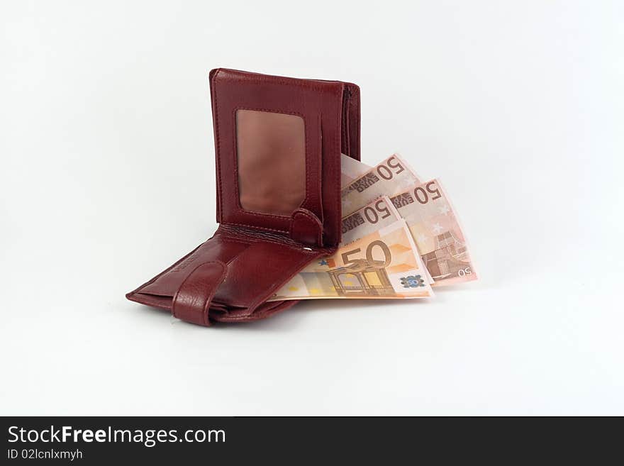 Banknotes falling from the wallet located on a white background. Banknotes falling from the wallet located on a white background