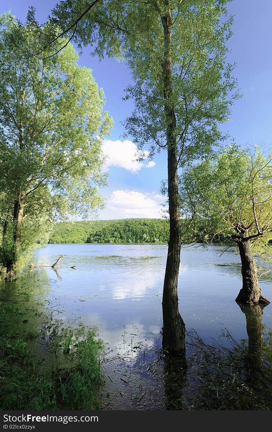 Picturesque lake below the blue sky. Picturesque lake below the blue sky