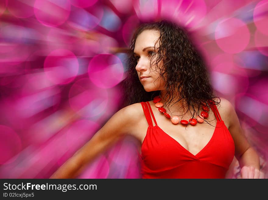 Beautiful dancing girl on blur background