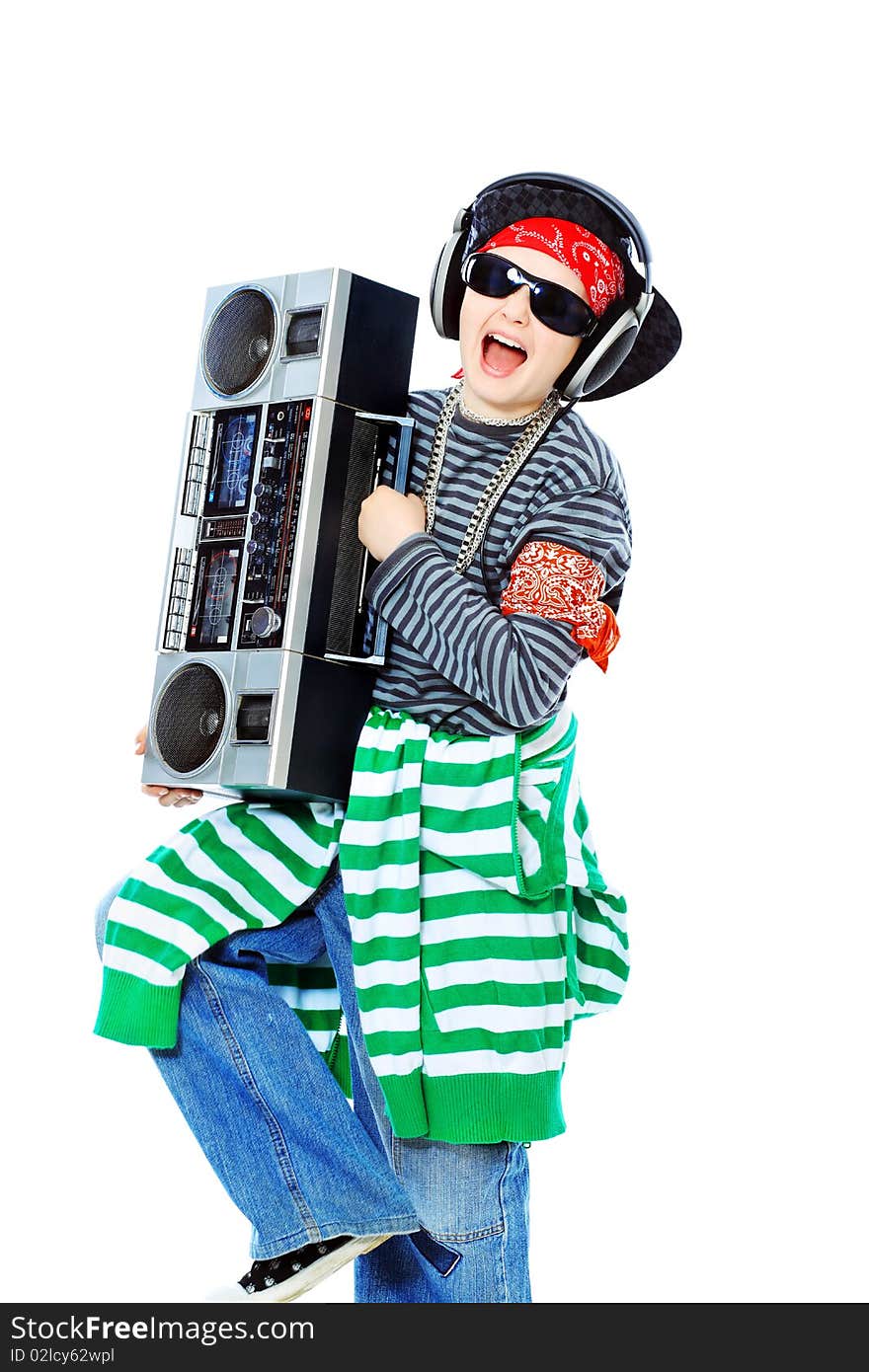 Shot of a trendy teenager listening to music in headphones. Isolated over white background. Shot of a trendy teenager listening to music in headphones. Isolated over white background.