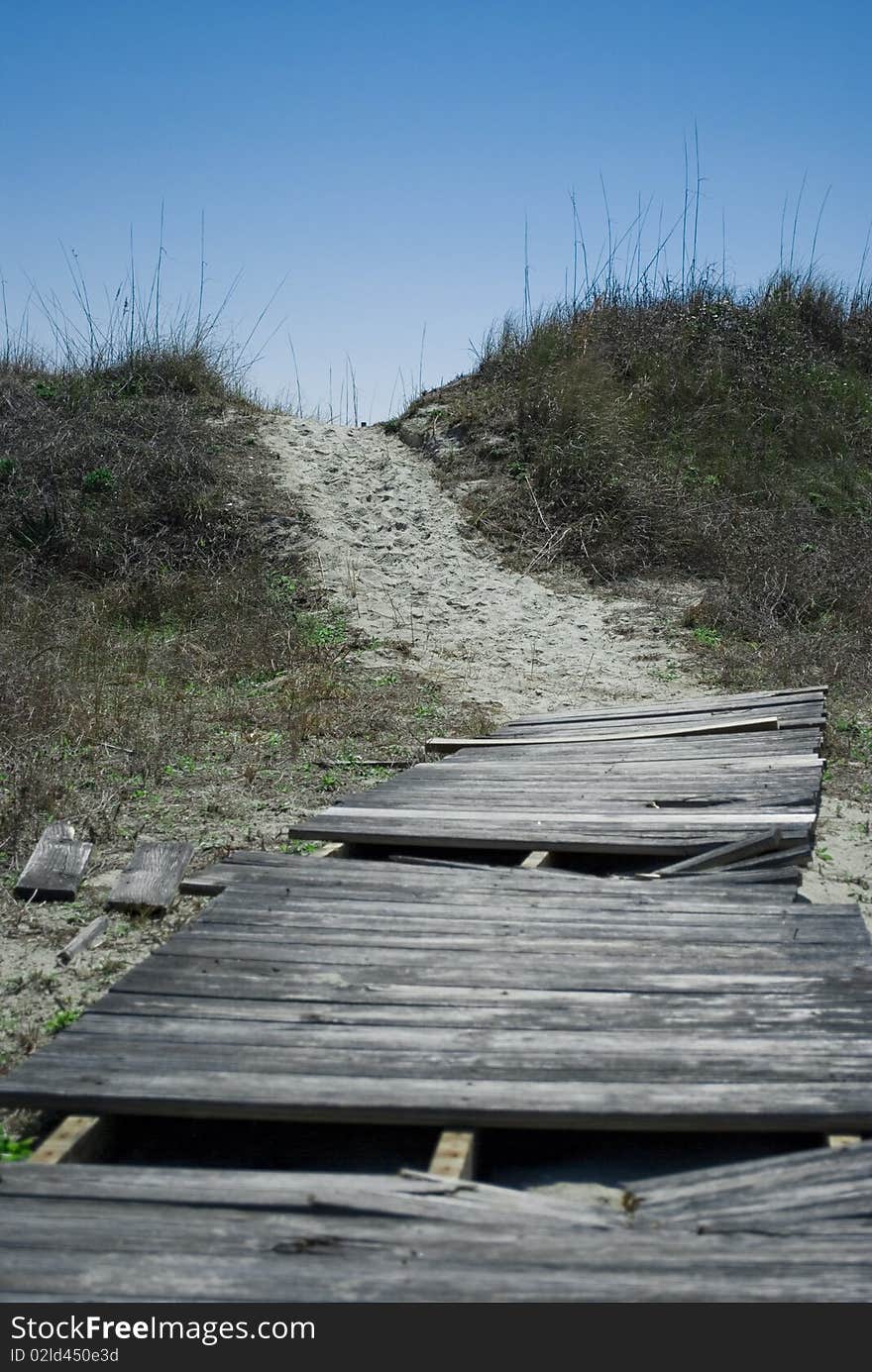 Old broken boardwalk to the beach