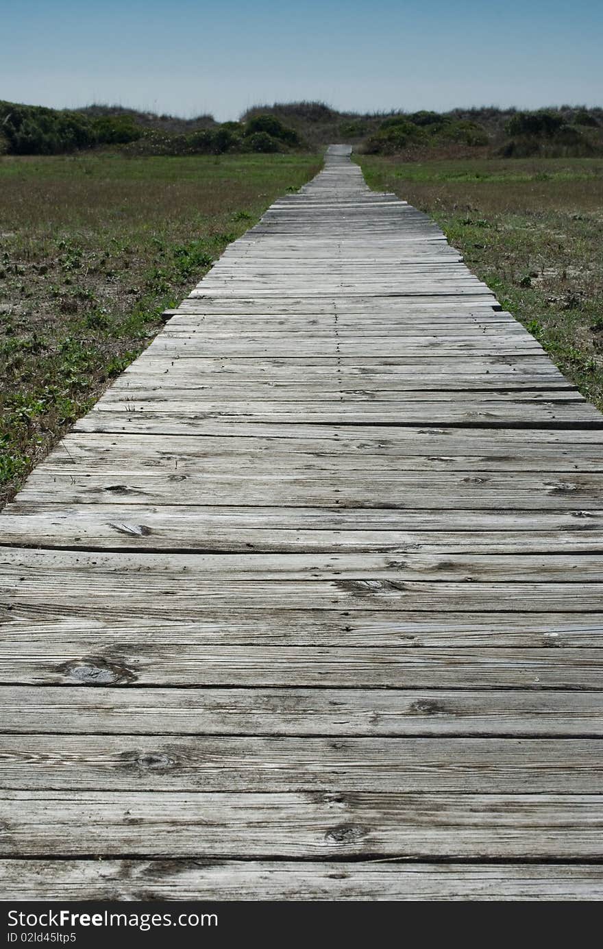 Old Broken Boardwalk To The Beach