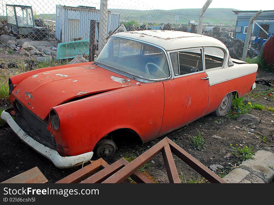 Old rusted American car and junked car. Old rusted American car and junked car