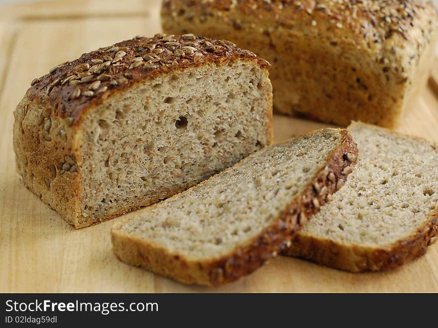 Sliced bread with grains on the board