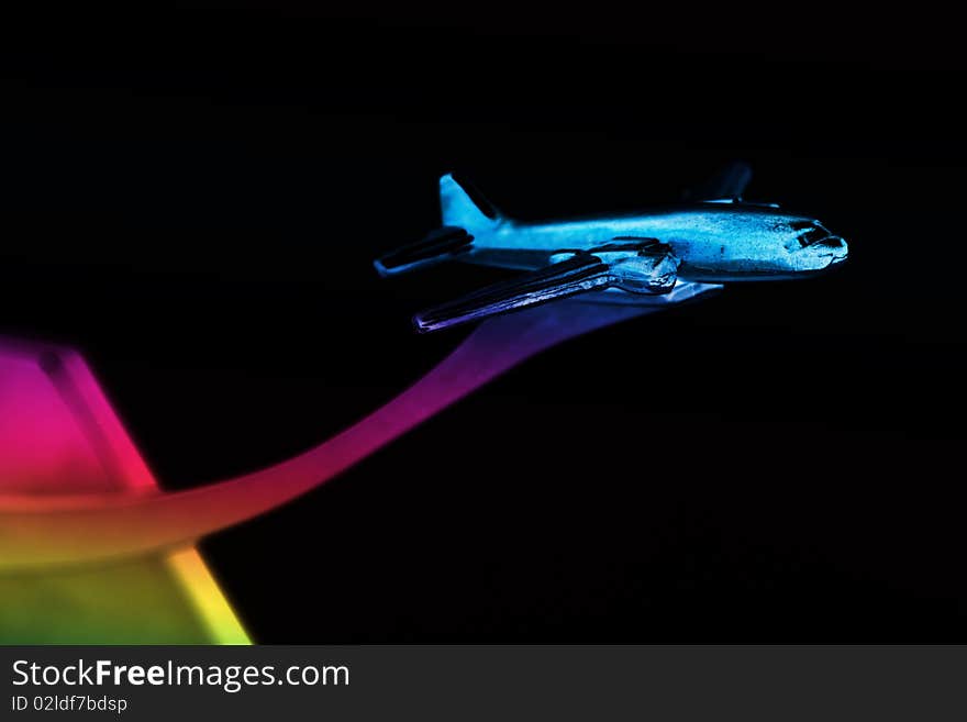 Colorful small metallic airplane isolated