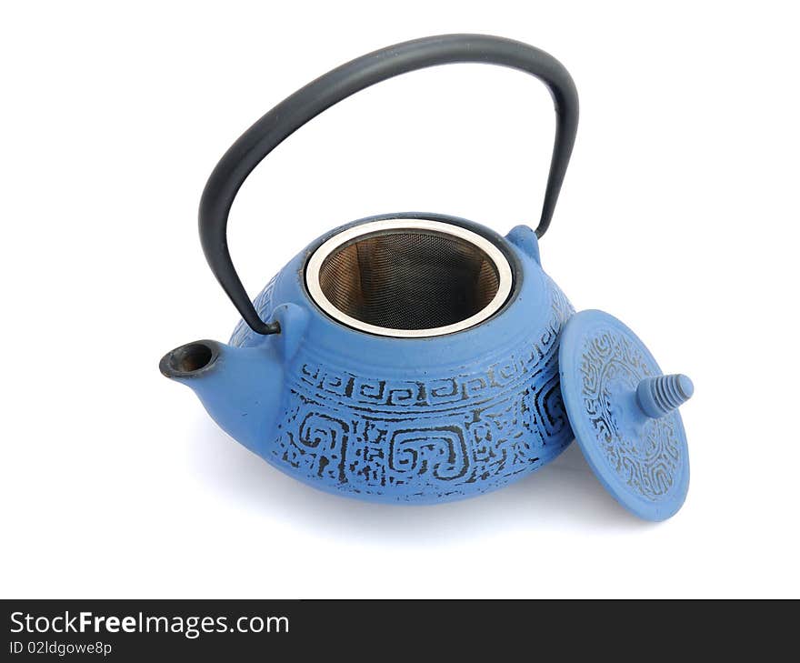 Blue iron teapot with a cap opened and tea strainer. Blue iron teapot with a cap opened and tea strainer