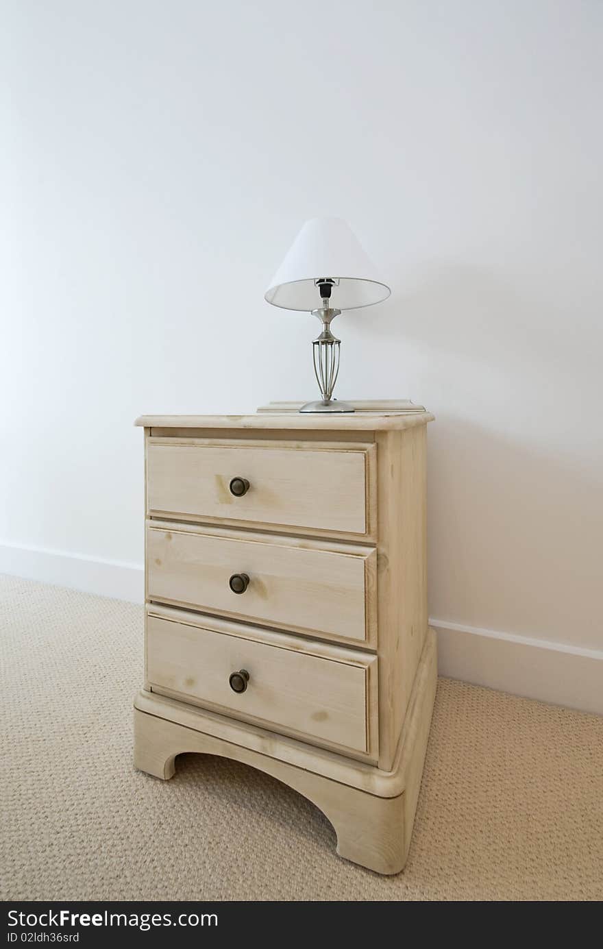 Detail of a classic wooden bedside table