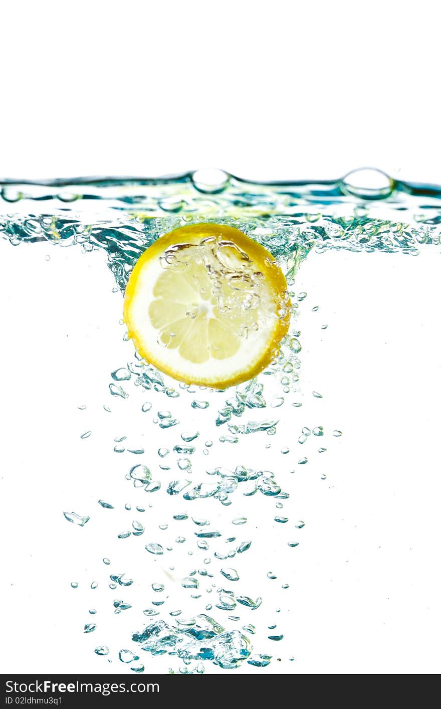 Fresh lemon splashing water isolated on white. Fresh lemon splashing water isolated on white