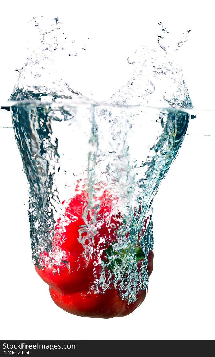 Water splash on red pepper isolated on white. Water splash on red pepper isolated on white