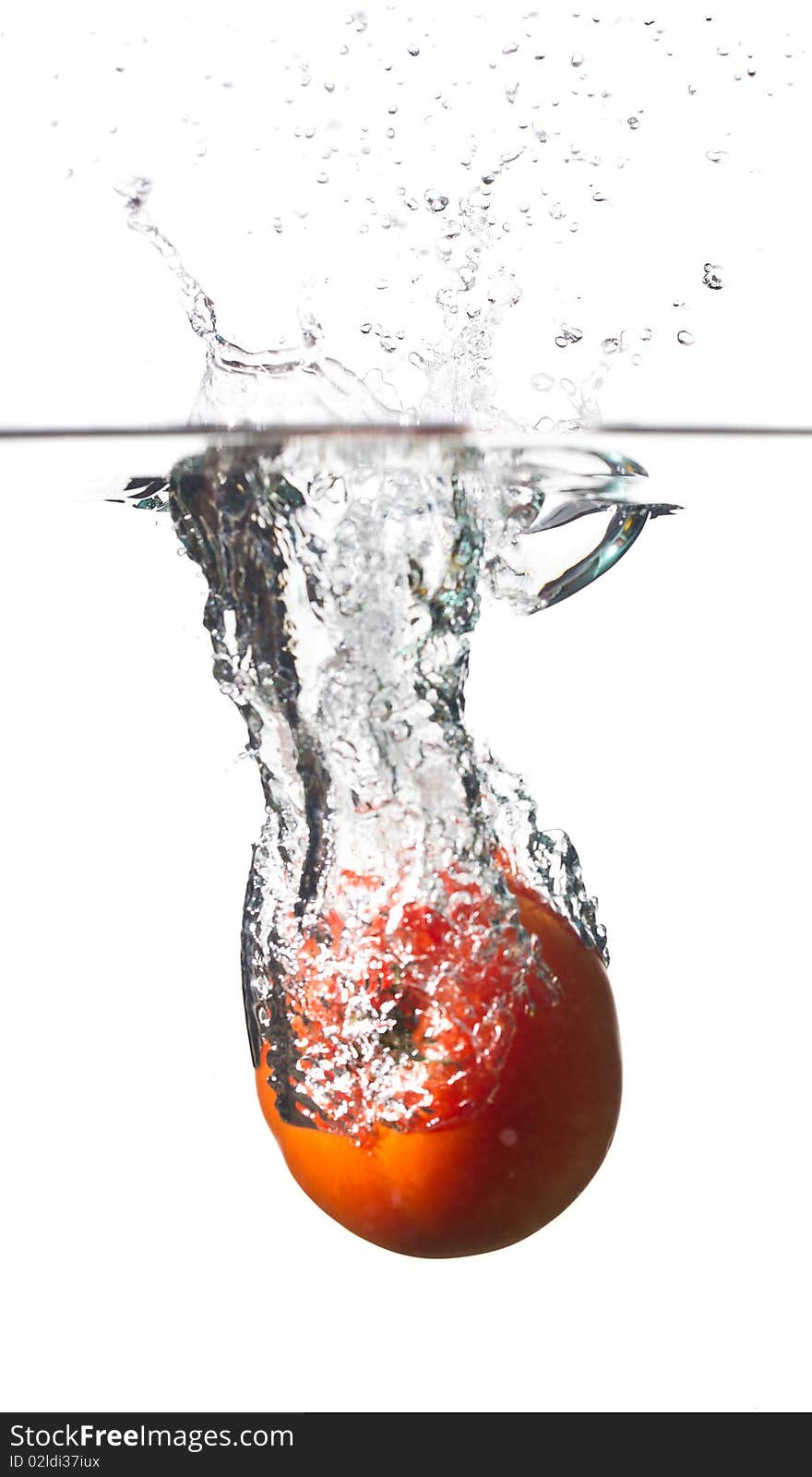 Water splashing from a tomato. Water splashing from a tomato