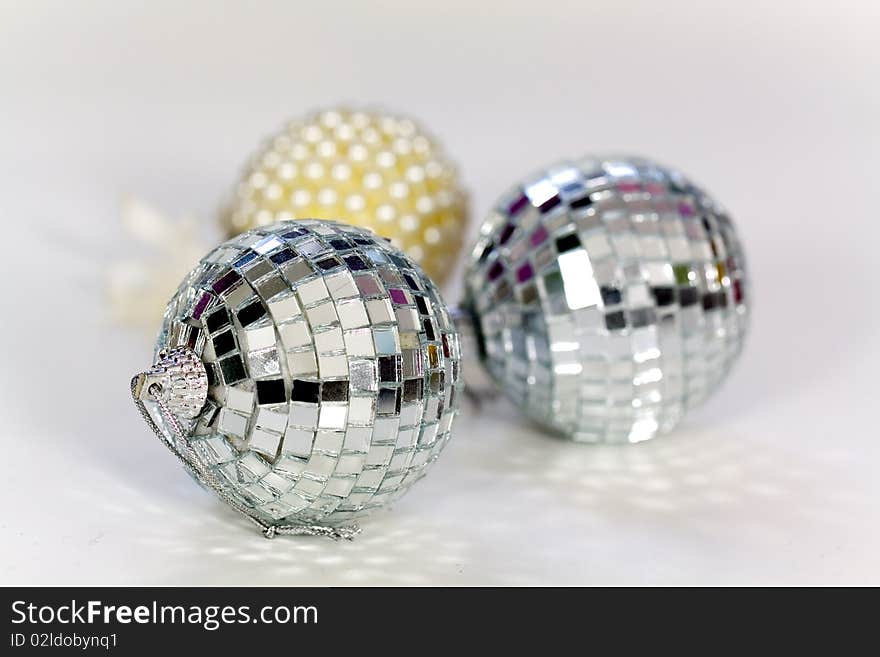 Three silver white Christmas ornaments