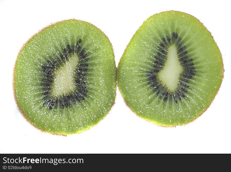 Pieces of kiwi isolated on white wet background