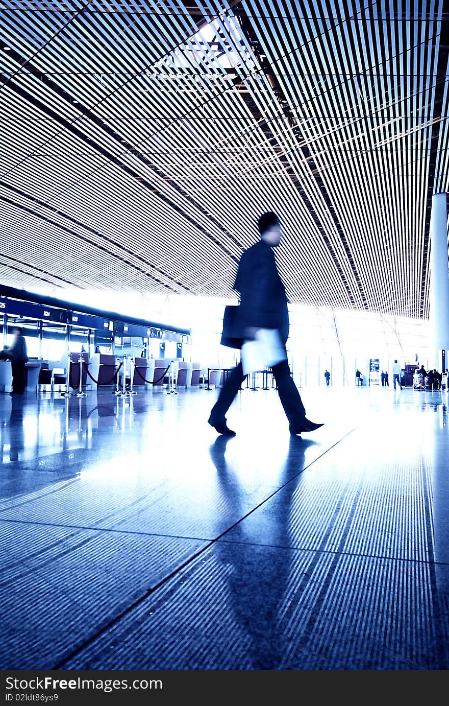 People hurrying in airportPeople