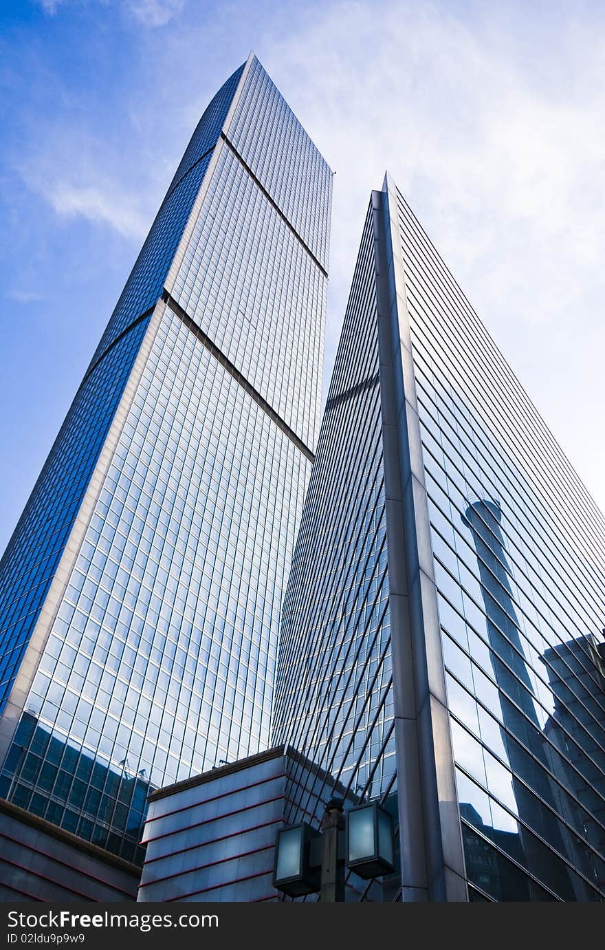 Highrise glass building with sky and clouds reflection. Highrise glass building with sky and clouds reflection