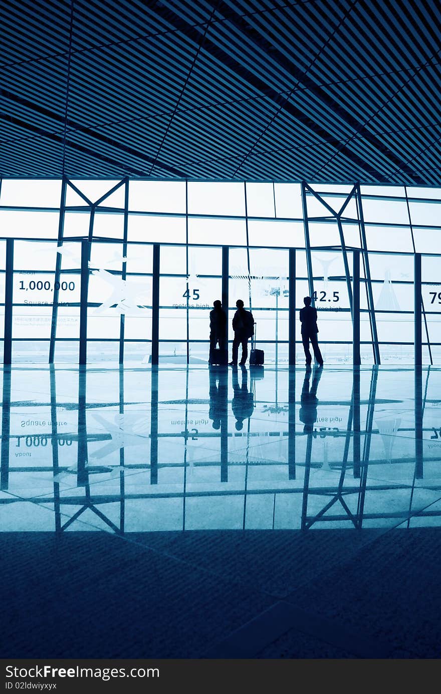 Travelers silhouettes at Beijing airport. Travelers silhouettes at Beijing airport