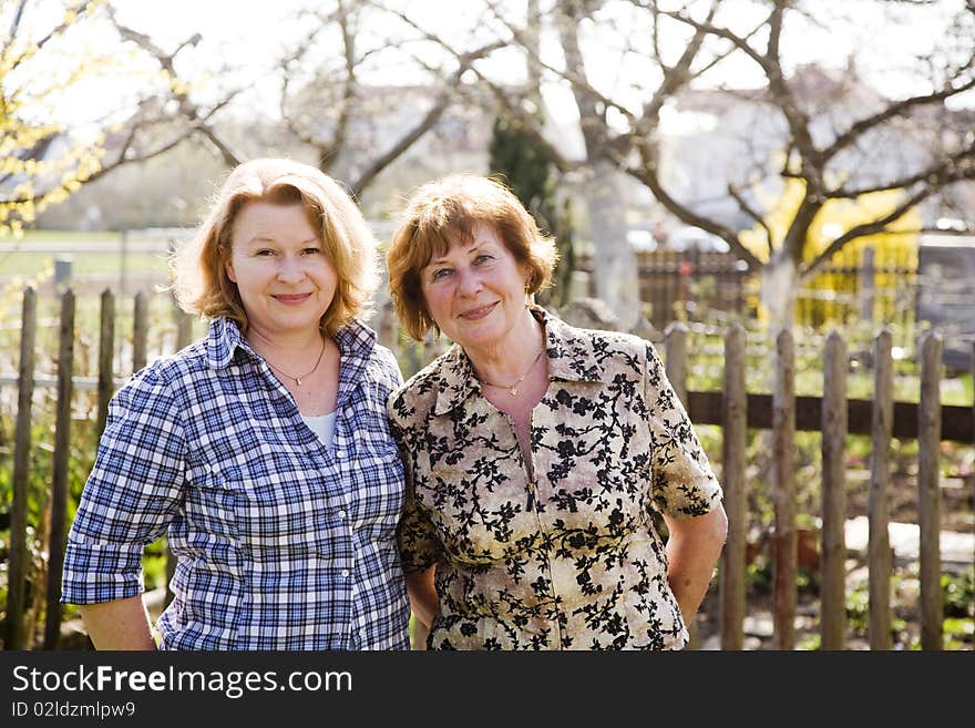 Mother and daughter, red haired looking confident and happy