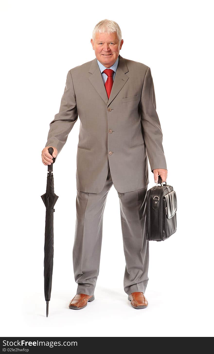 Successful mature business man on white background, with umbrella and briefcase. Successful mature business man on white background, with umbrella and briefcase