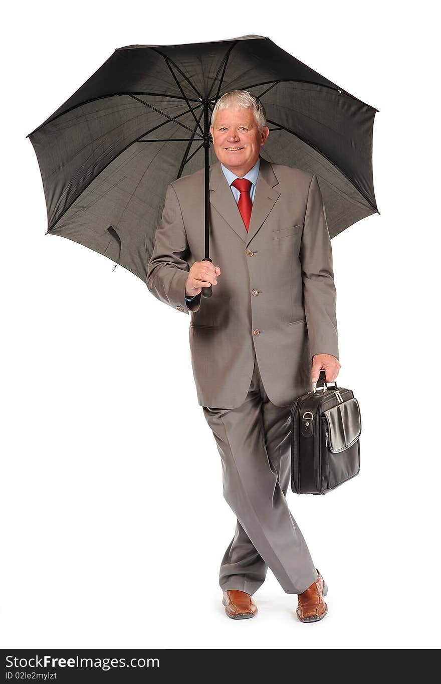 mature businessman with umbrella and briefcase