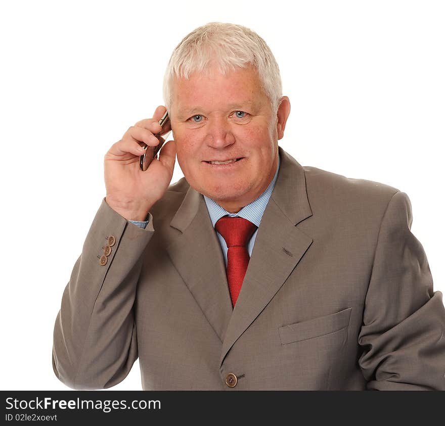 Successful mature business man on white background, using a cellphone or mobile. Successful mature business man on white background, using a cellphone or mobile