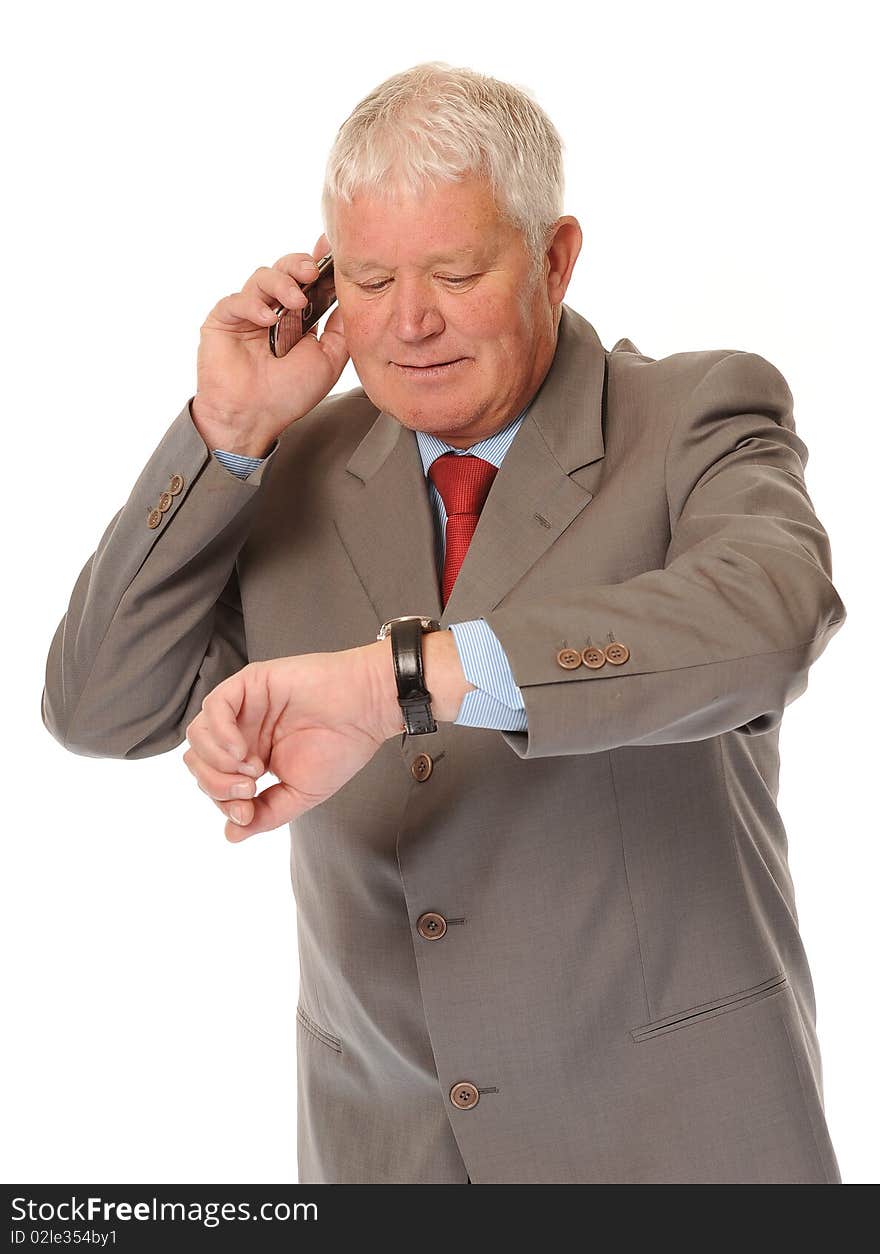 Successful mature business man on white background, using a cellphone or mobile. Successful mature business man on white background, using a cellphone or mobile