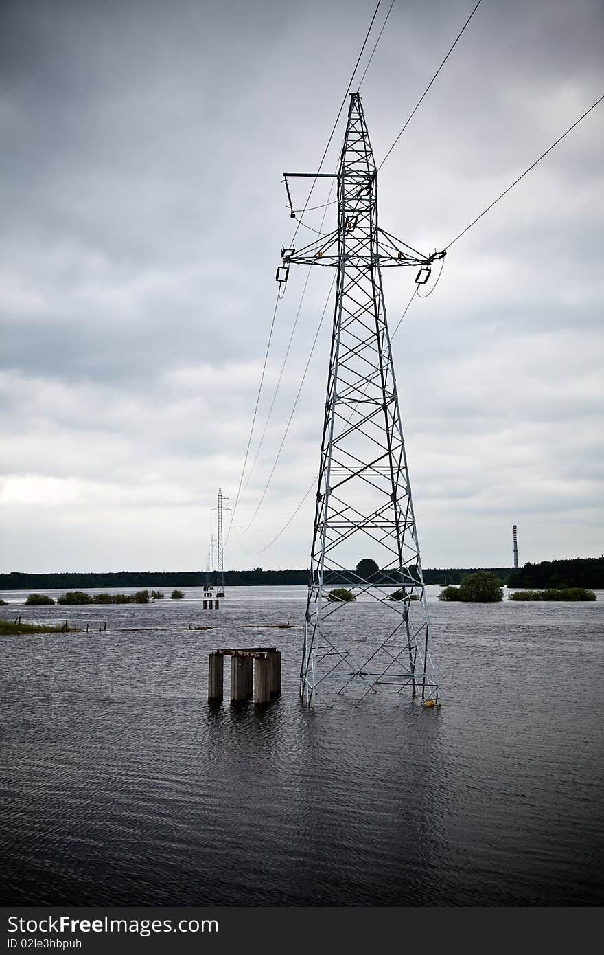 Flooded by river power lines landscape. Flooded by river power lines landscape