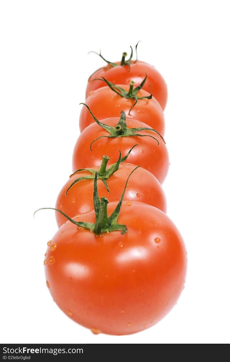 Five tomatoes on white background