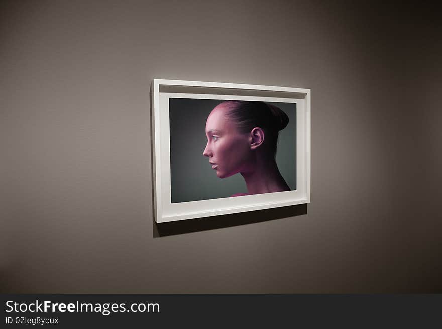 View of a frame with the photo of a beautiful woman. View of a frame with the photo of a beautiful woman