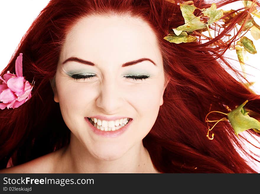 A beautiful young woman with flowers in her hair. A beautiful young woman with flowers in her hair.