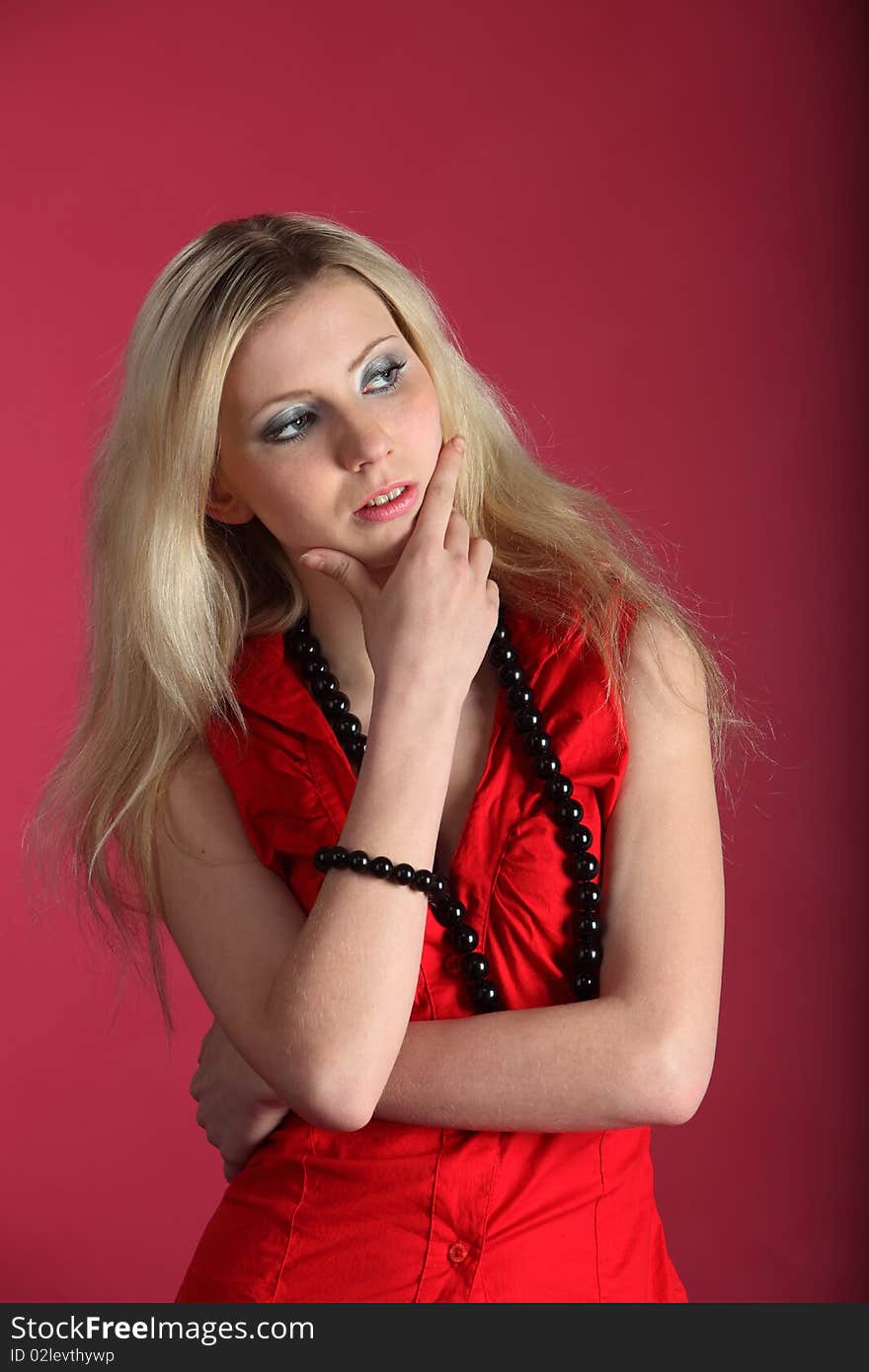 Girl in a red. Studio shot