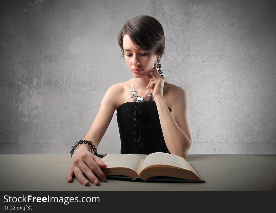 Attractive woman reading a book. Attractive woman reading a book